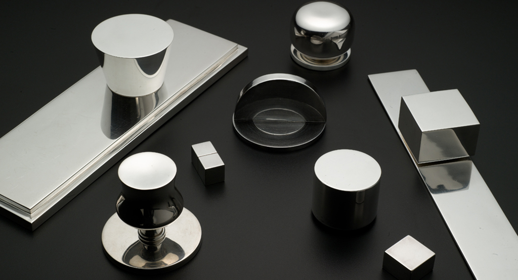 Modern silver and polished nickel geometric hardware ensemble.