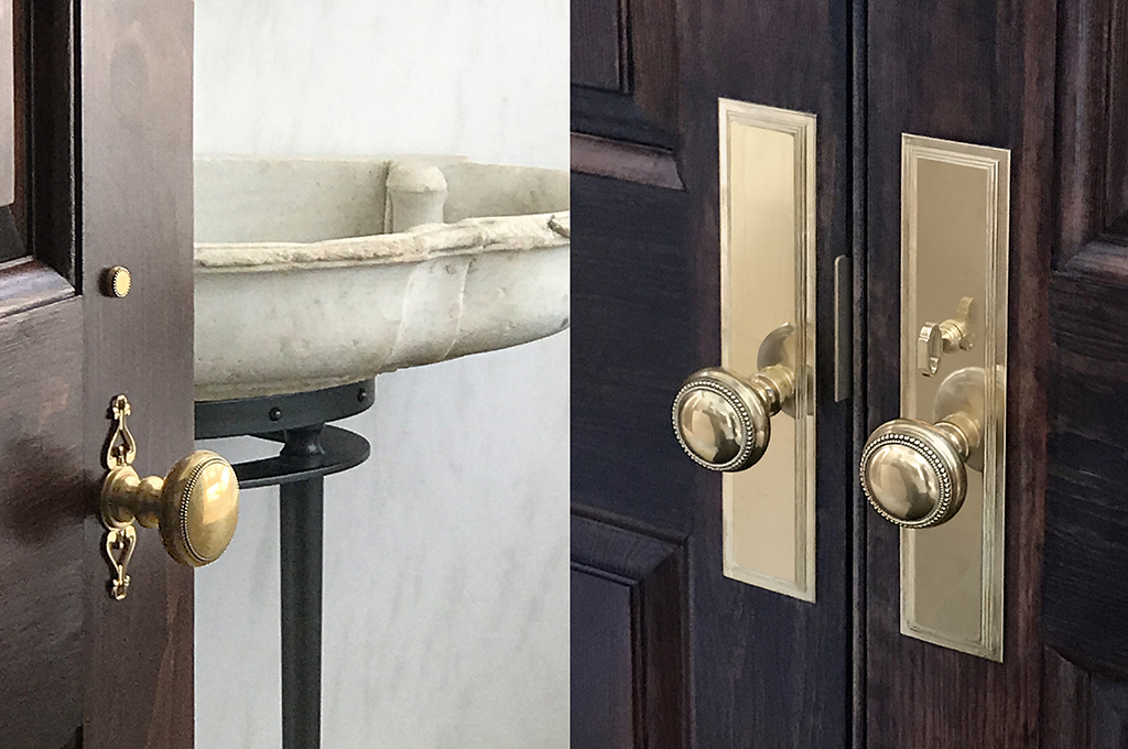 Custom historic door hardware in brass with filigree details and delicate beading for a Colonial Revival residence.