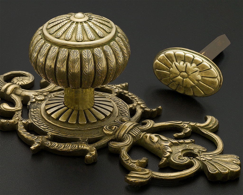 Historical reproduction of 18th century door hardware in antique brass finish.